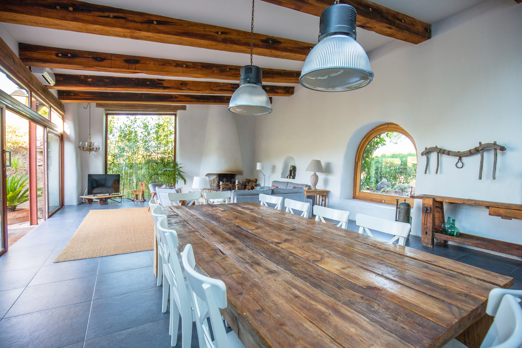 Elegant farmhouse dining room, living room in Barcelona